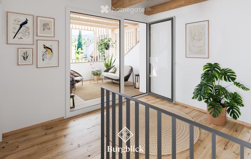 Modern living room with wooden flooring, white walls, large open sliding doors leading to a balcony, several framed pictures, and potted plants.