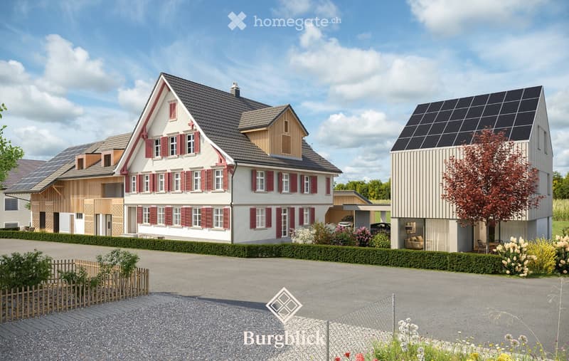 Three modern houses with solar panels on the roofs, surrounded by a well-maintained garden and driveway.