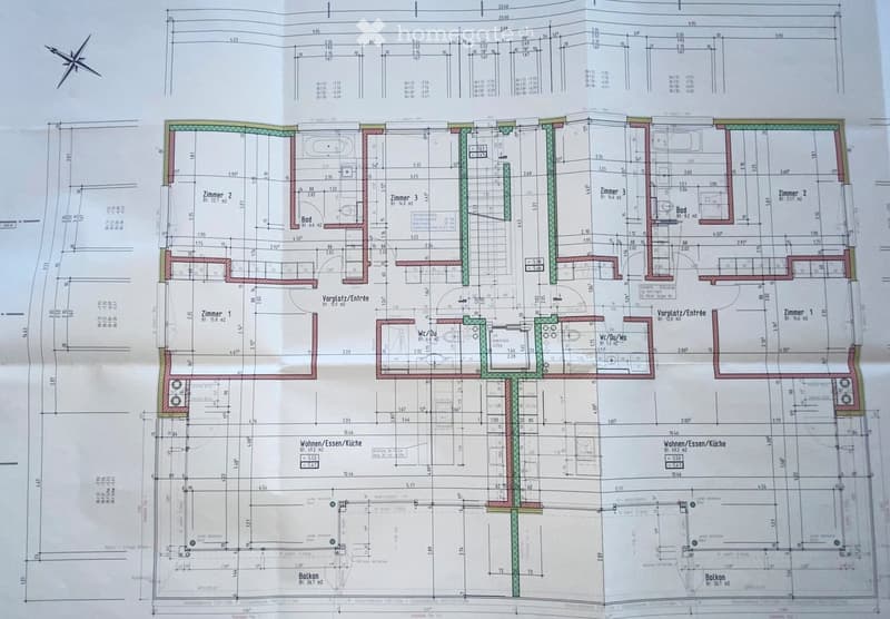 Floor plan of a residential unit with labeled rooms including living/dining area, kitchen, bedrooms, bathrooms, and a balcony.
