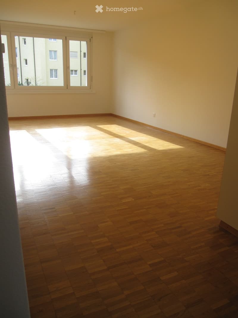 empty room, wooden floor, white walls, large window, sunlight