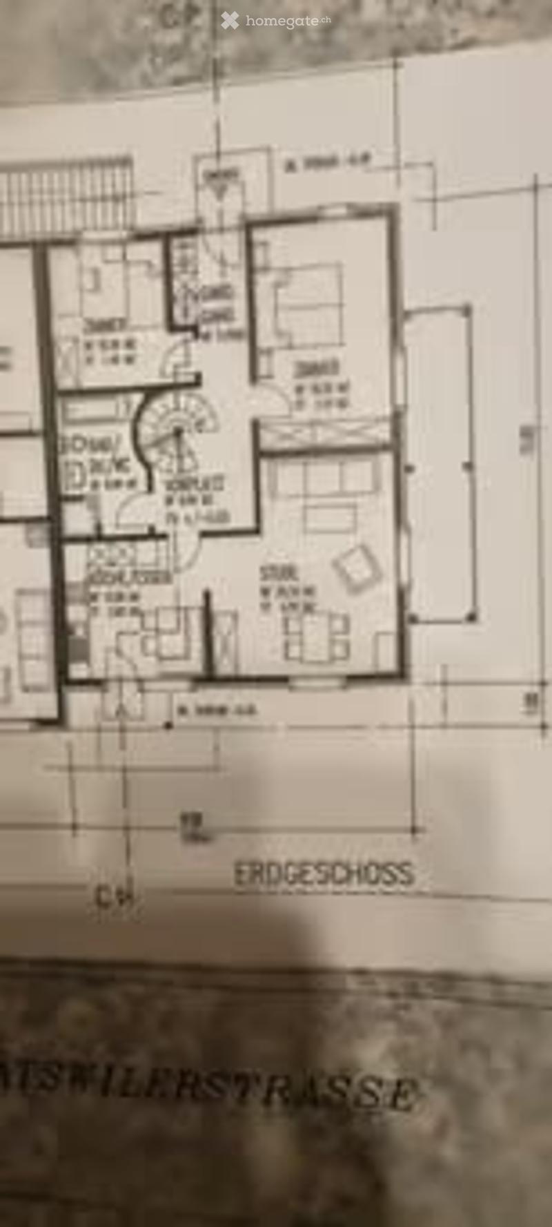 Floor plan of a multi-room building, including a living room, dining room, kitchen, bedrooms, bathrooms, and a staircase.