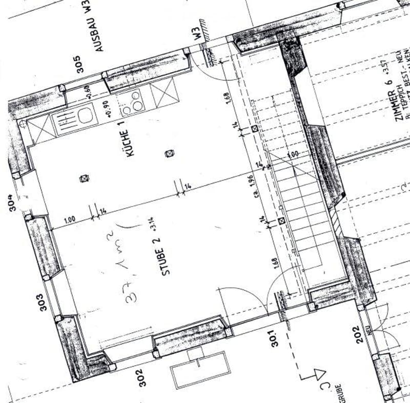 Floor plan of a residential unit showing a kitchen, two bedrooms, and a bathroom. Dimensions and room labels are indicated.
