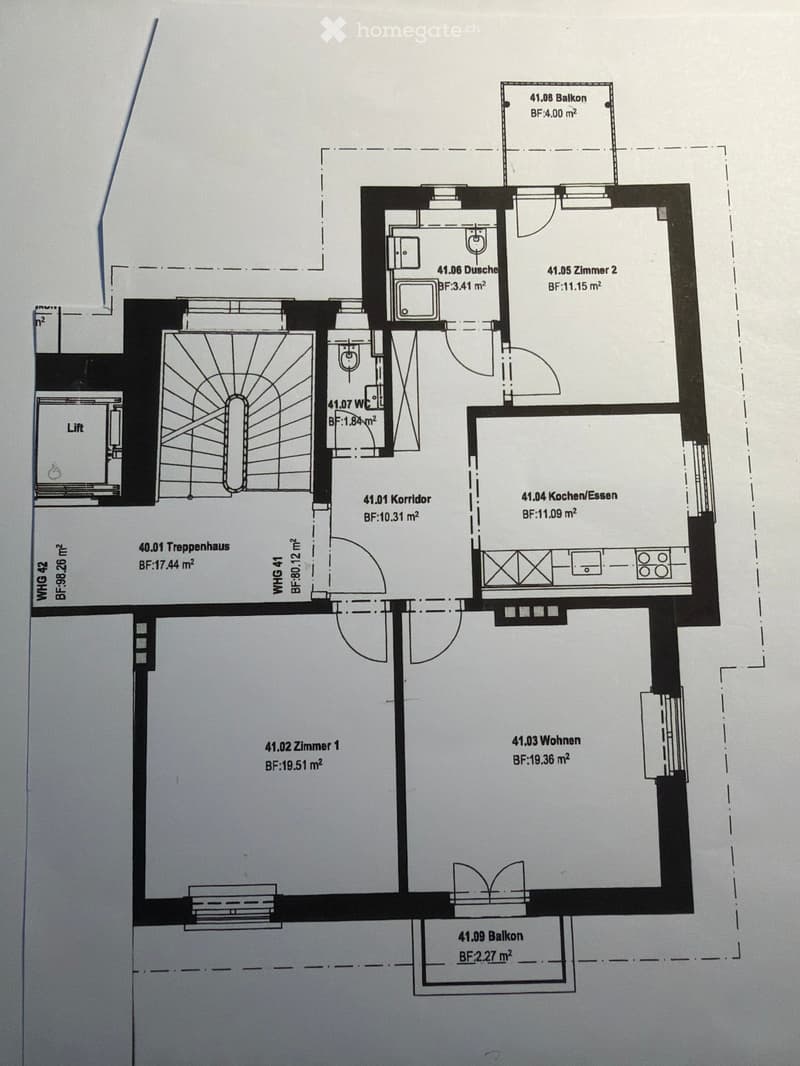 Floor plan showing a layout with a living area, kitchen, two bedrooms, bathrooms, a balcony, and a staircase.