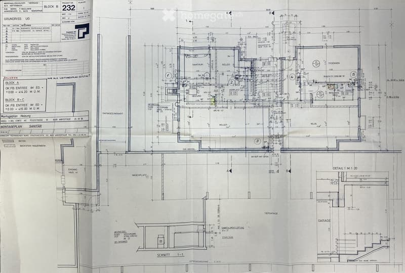 Architectural floor plan showing multiple residential units, labeled as Block B and Block A, with detailed dimensions and room labels including entrance, kitchen, living room, and garage areas.