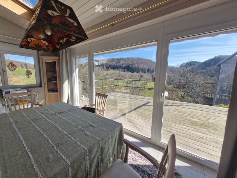 dining room with table, chairs, and a view of the mountains