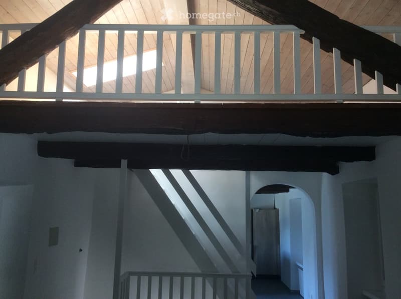 wooden beams, metal handrail, small window, staircase with stairs