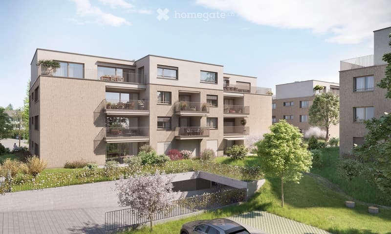 Modern multi-story residential building with balconies, surrounded by greenery and a parking area.