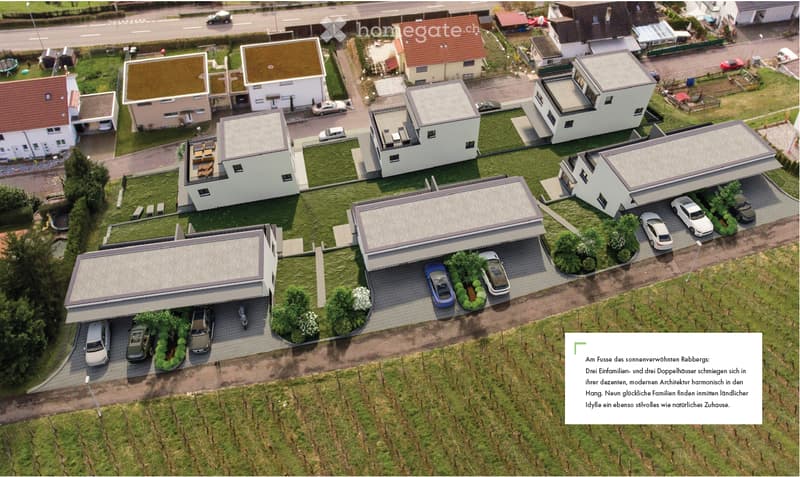 Aerial view of a residential neighborhood with multiple houses, driveways, and parked cars.