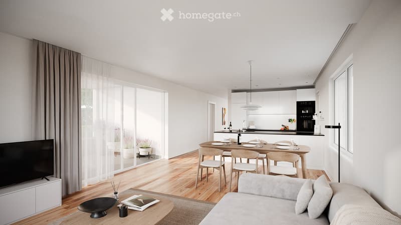 Modern living room with wooden floor, white walls, and large windows. Features a dining area with a wooden table and chairs, a sofa with pillows, and a TV on a cabinet. The kitchen is visible in the background with white cabinets and black appliances.