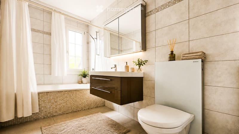Modern bathroom with a bathtub, sink, toilet, mirror, and various decorative items including towels, a vase with plants, and a soap dispenser.