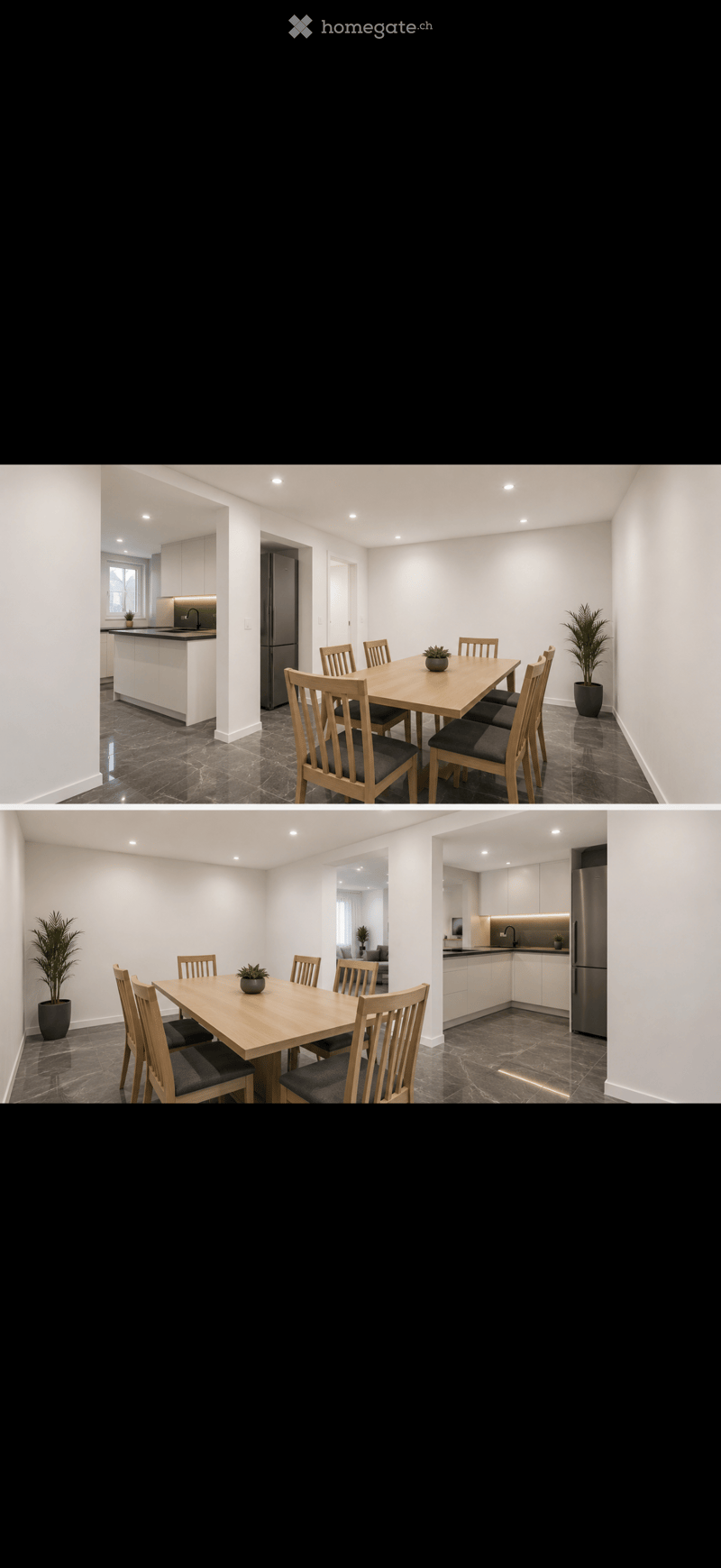 Modern dining area with a wooden dining table and six chairs, a kitchen island with a sink, and a refrigerator. Potted plants are placed near the table and on the kitchen island.