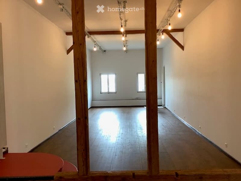 Wide open space, wooden beams, large windows, wooden floor