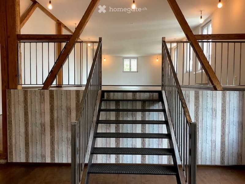 loft style, metal railings, wooden floors, beams, windows, stairs