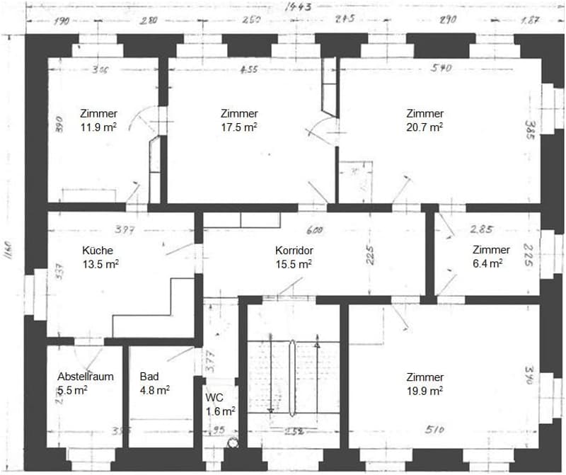 Floor plan of a multi-room apartment with labeled rooms including kitchen, corridor, bathroom, WC, and several bedrooms with specified square meterages.