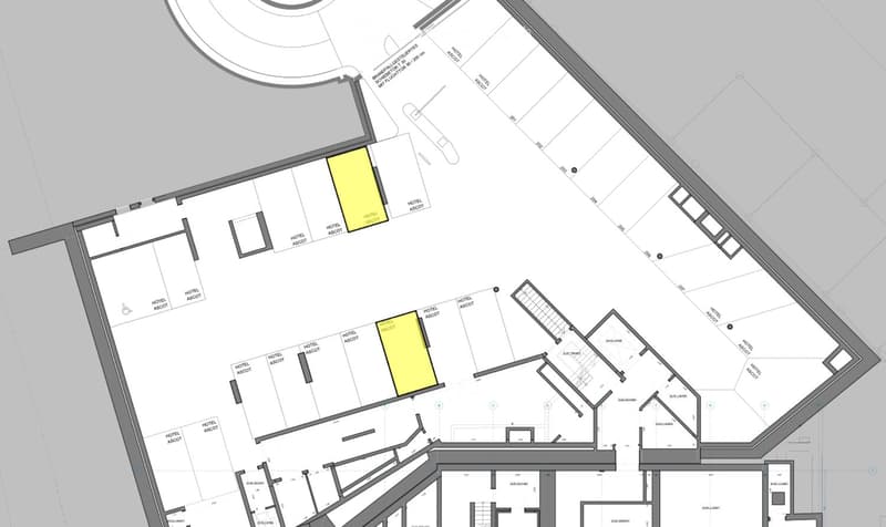 Floor plan of a hotel complex with multiple labeled sections, including hotel areas, parking, and surrounding buildings.