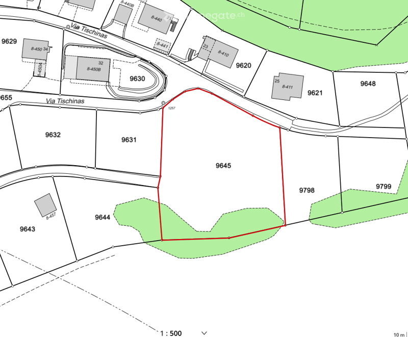 Floor plan showing multiple plots and structures with labeled areas and boundaries.