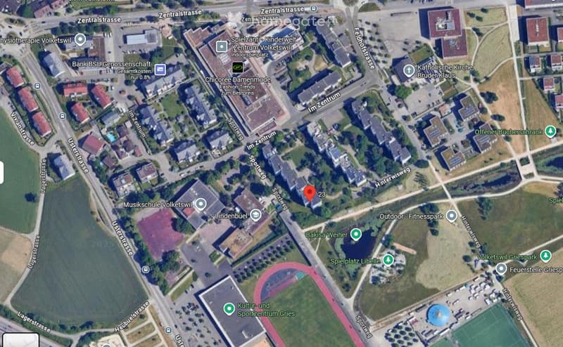 A map view of a town area showing streets, buildings, and landmarks such as a music school, a church, and a sports center.
