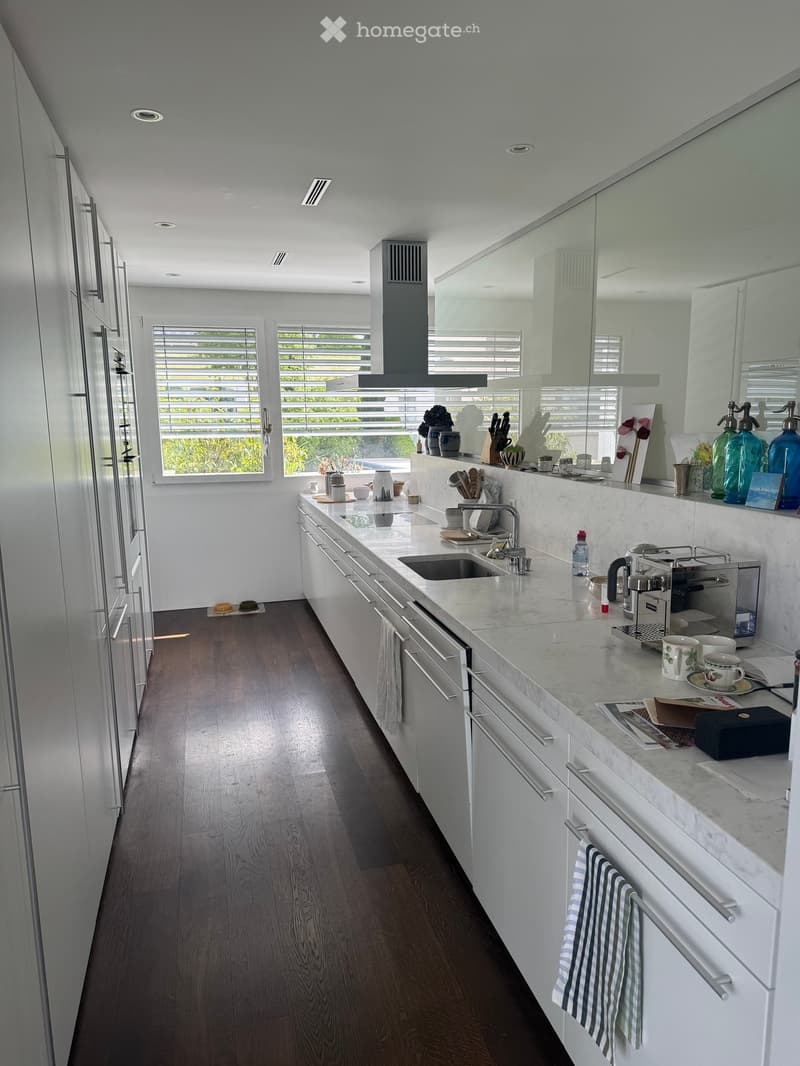 {"type": "Kitchen", "objects": ["sink", "faucet", "coffee maker", "cup", "towel", "cupboard", "fridge", "oven", "kitchen island", "bottle", "cupboard", "faucet", "cup", "cupboard", "cupboard", "cupboard", "cupboard", "cupboard", "cupboard", "cupboard", "c