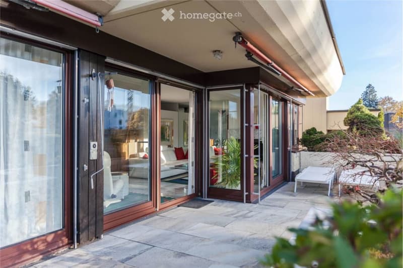 outdoor seating area with tables, cushioned chairs, potted plants, sliding glass doors