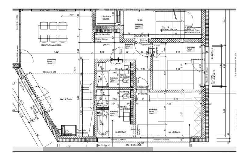 Floor plan of a building showing multiple rooms including a garage, living area, bedrooms, and bathrooms. Dimensions and labels are provided for each space.