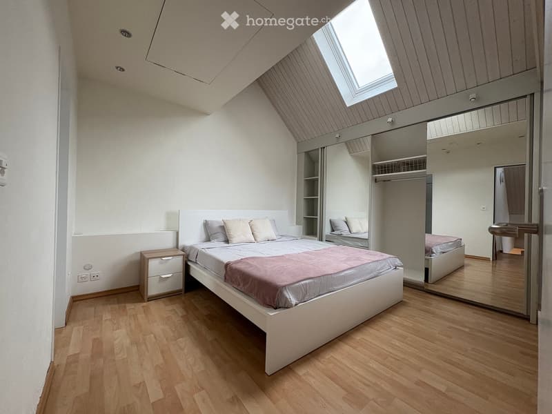 bedroom, wooden floor, white bed, white nightstand, mirror closet, white walls, skylight