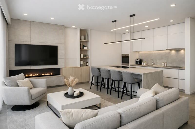 Modern open-plan living and dining area with a fireplace, sofa, coffee table, armchair, and kitchen island with bar stools. The kitchen features white cabinets, a sink, and an oven.