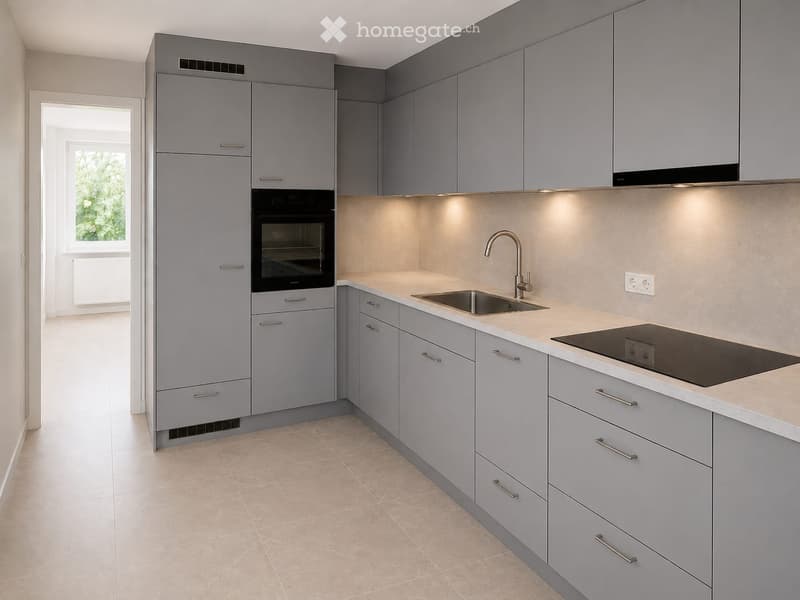 Modern kitchen with grey cabinets, a stainless steel sink, a built-in oven, and a stovetop, featuring a light-colored countertop and tiled flooring.