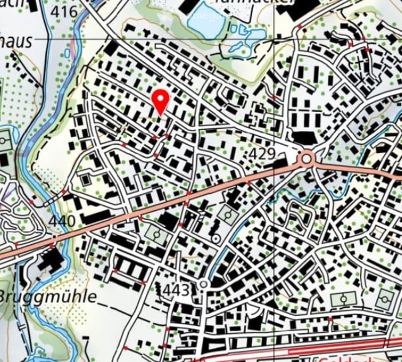 A detailed map showing a dense urban area with streets, buildings, and a highlighted location marked with a red pin.