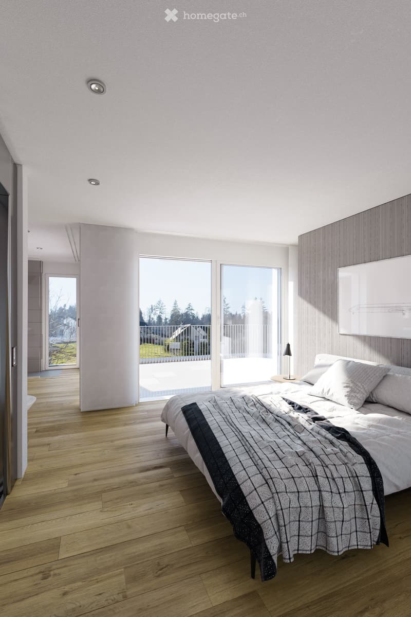 Modern bedroom with wooden flooring, large windows, and a bed with a checkered blanket.