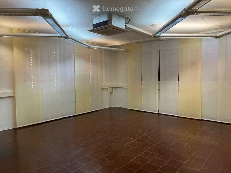 empty room, brown tiled floor, white walls, white curtains, ceiling lights