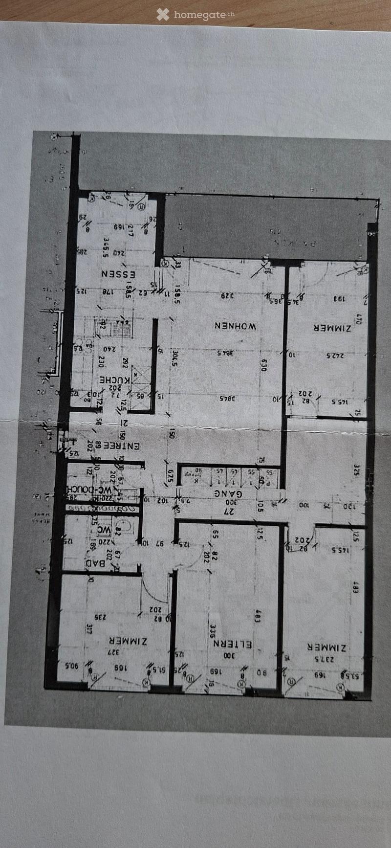 Floor plan showing multiple rooms including living room, dining room, kitchen, bedrooms, and bathrooms with labeled dimensions.