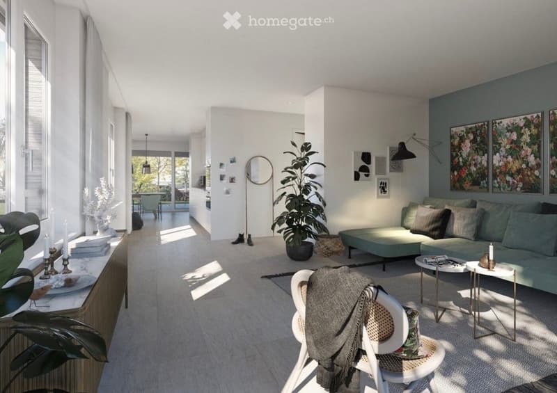 Modern living room with a grey sofa, coffee table, white chair with a blanket, floor lamp, round mirror, large plant, and decorative candles on a side table.