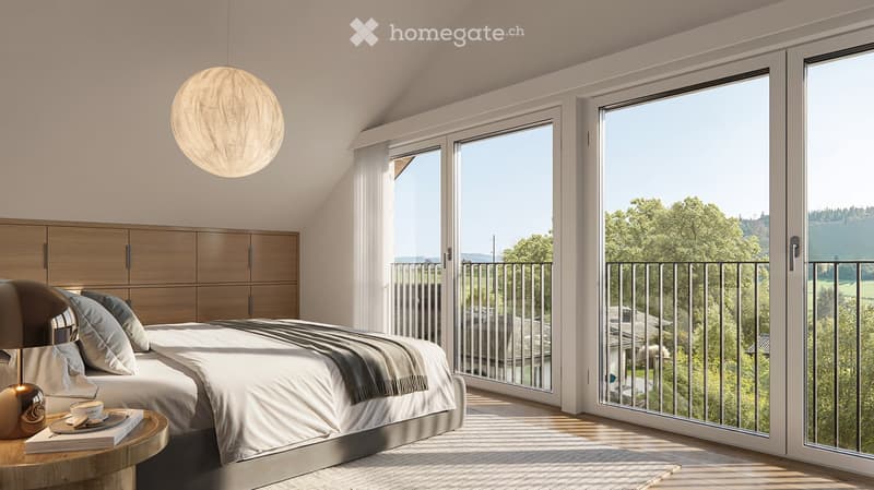 Modern bedroom with large windows offering a scenic view, featuring a bed with pillows and blankets, a nightstand with a lamp, and a wardrobe.