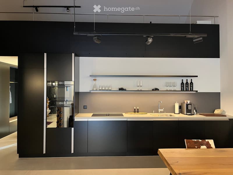 {"type": "Kitchen", "objects": ["refrigerator", "sink", "faucet", "coffee maker", "table", "chair", "cup", "bottle", "faucet", "faucet", "bottle", "bottle", "bottle", "bottle", "bottle", "bottle", "bottle", "bottle", "bottle", "bottle", "bottle", "bottle"