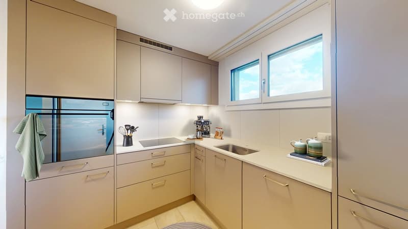 Modern fitted kitchen, white countertops, modern appliances, fitted cabinetry, tiled flooring, window