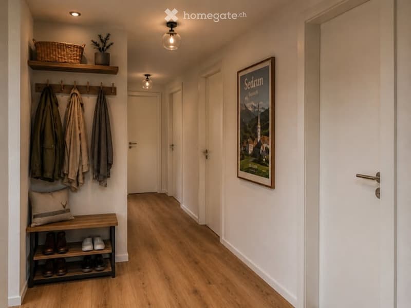 A modern hallway with wooden flooring, white walls, and built-in storage. Features include a coat rack with jackets, a small bench with shoes, a framed picture, and a potted plant on a shelf.