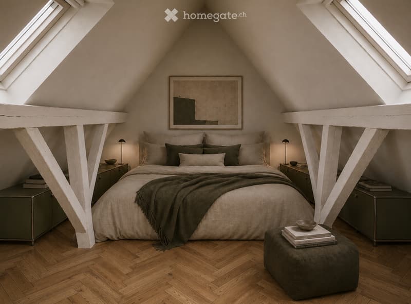 Cozy attic bedroom with wooden floors, slanted ceilings, skylights, a large bed with pillows and blankets, nightstands with lamps, an ottoman with books and a bowl, and a framed mirror on the wall.