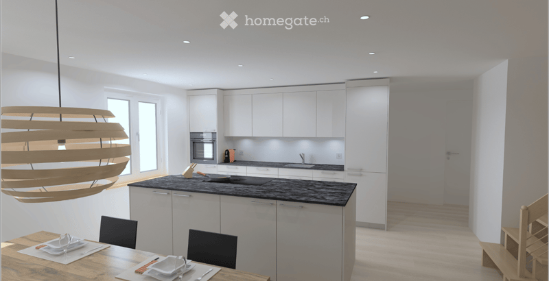 Modern kitchen with white cabinets, black countertop, built-in oven, sink, and a wooden dining table with chairs. A large pendant light hangs from the ceiling.