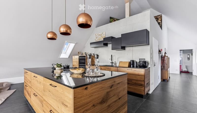 modern kitchen with wooden cabinets, black countertops, copper pendant lights, black appliances, skylight