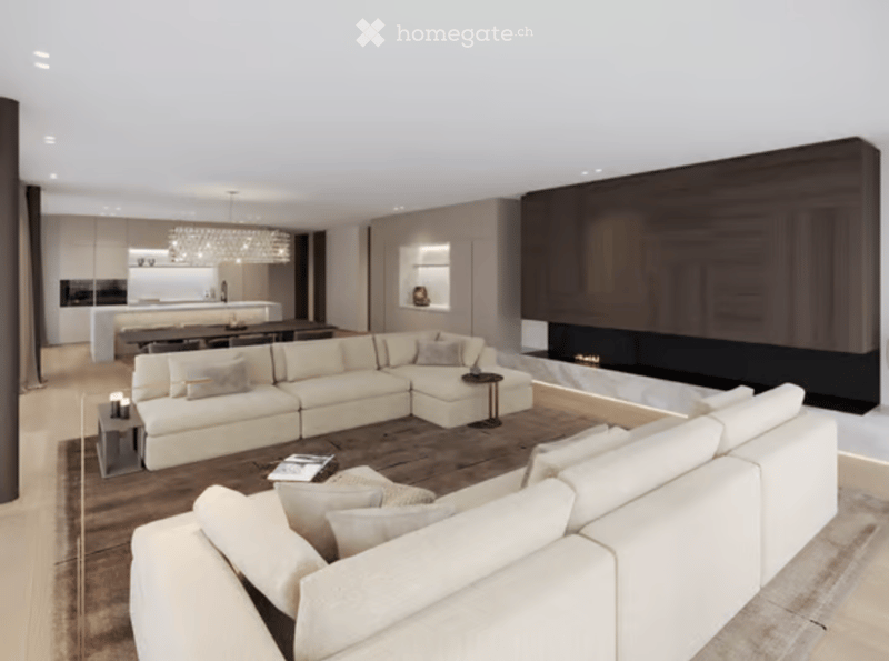 Modern living room with a large sectional sofa, coffee table, fireplace, dining area, and chandelier.