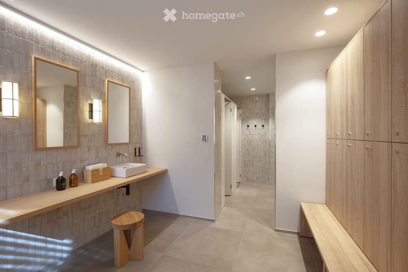 modern bathroom with wooden bench, wooden stool, two mirrors, sink, wooden wall, tiled floor, wooden cabinets