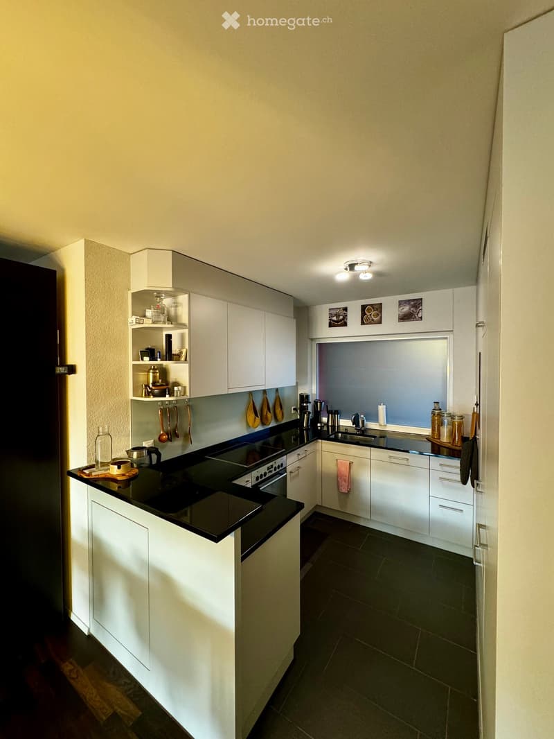 {"type": "Kitchen", "objects": ["cabinets", "sink", "faucet", "oven", "stove", "cupboard", "cup", "bottle", "frying pan", "oven mitts", "cupboard", "cupboard", "cupboard", "cupboard", "cupboard", "cupboard", "cupboard", "cupboard", "cupboard", "cupboard",