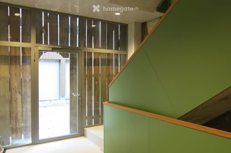 sliding glass door, wooden wall, green wall, white floor