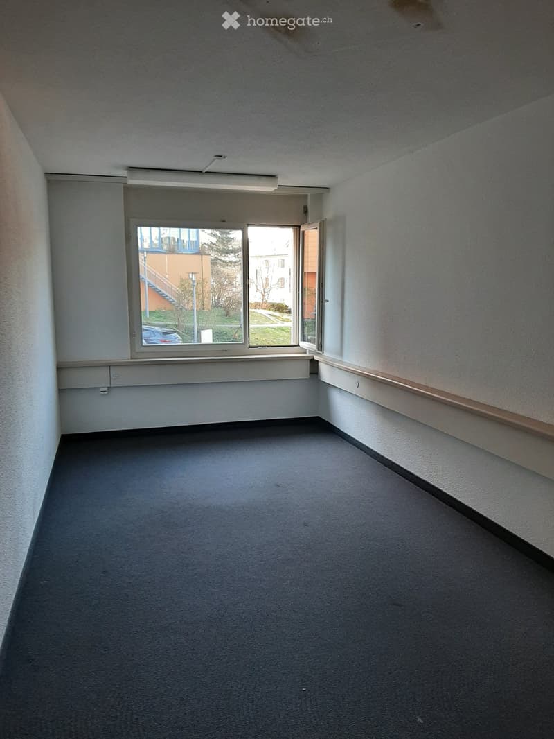 empty room, white walls, black floor, large window, white ceiling