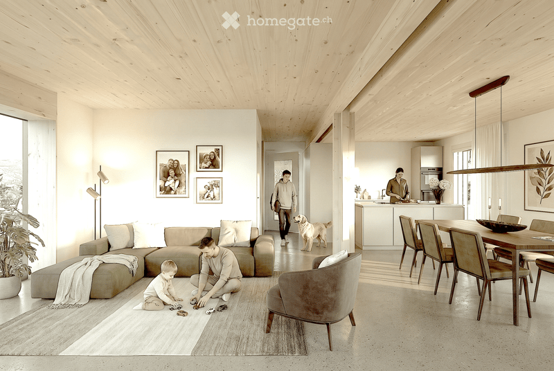 Open-plan living and dining area with light wood ceilings, white walls, and large windows. Features a sectional sofa, armchair, dining table with chairs, kitchen counter, and decorative elements like framed photos and a potted plant.