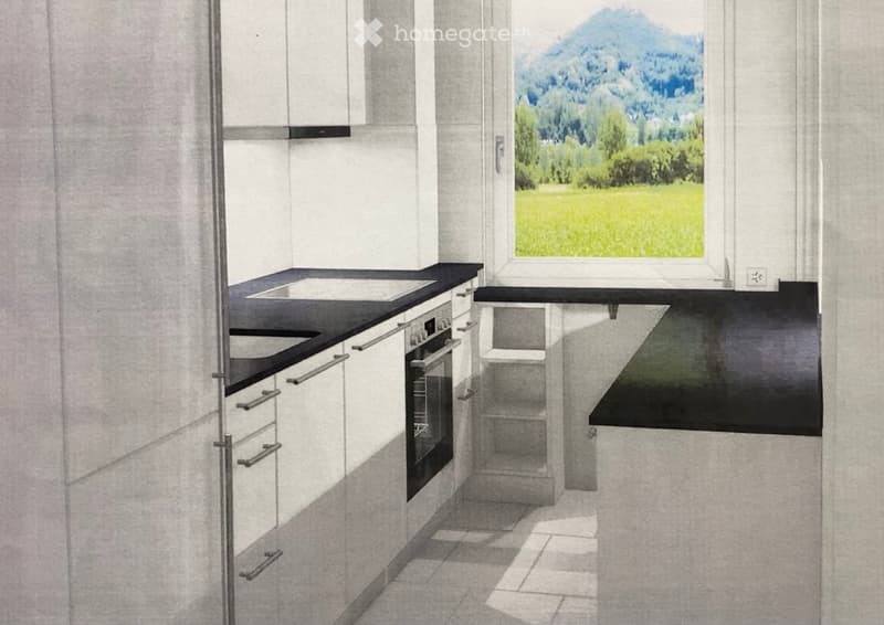 Modern kitchen with white cabinets, black countertops, and a large window overlooking a scenic landscape.