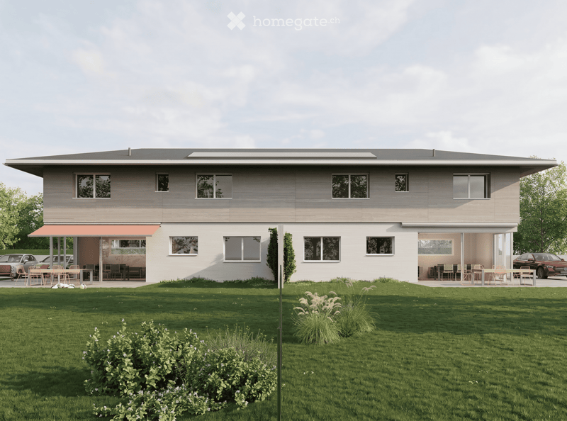 House. Modern two-story house with large windows, flat roof, and covered outdoor seating areas. The house is surrounded by a well-maintained lawn and garden.