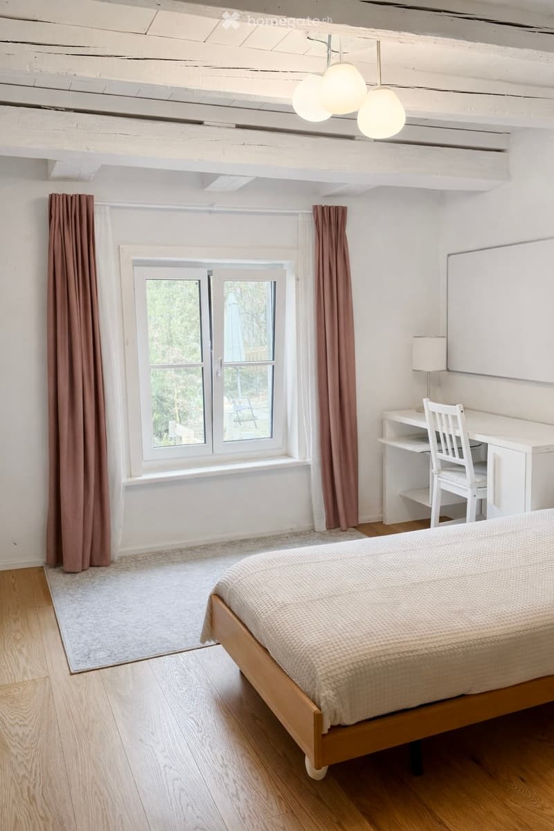 bedroom with bed, desk, lamp, window, curtains, rug, ceiling lamp