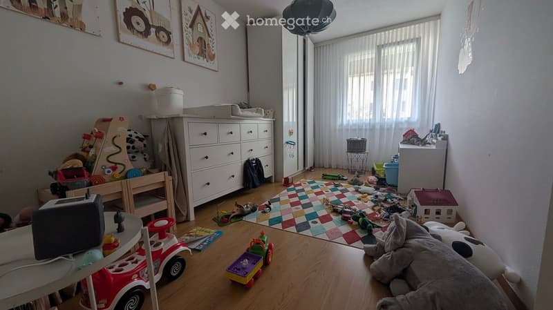 {"visible_features": [], "type": "Furnished Room", "objects": ["table", "chair", "toy car", "toy house", "toy truck", "toy elephant", "toy cow", "toy tractor", "toy airplane", "toy train", "toy boat", "toy helicopter", "toy motorcycle", "toy bus", "toy bi