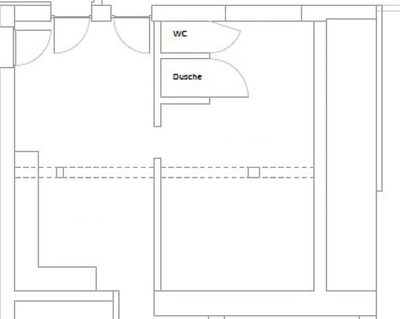 Floor plan of a small apartment with a living area, a bedroom, a bathroom (WC and Dusche), and a small kitchen area.